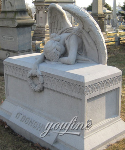 Classical weeping angel tombstone with garland grave decoration outdoor