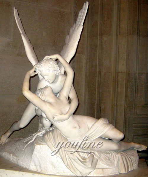 Outdoor marble statue of Psyche is received by Cupid’s kiss